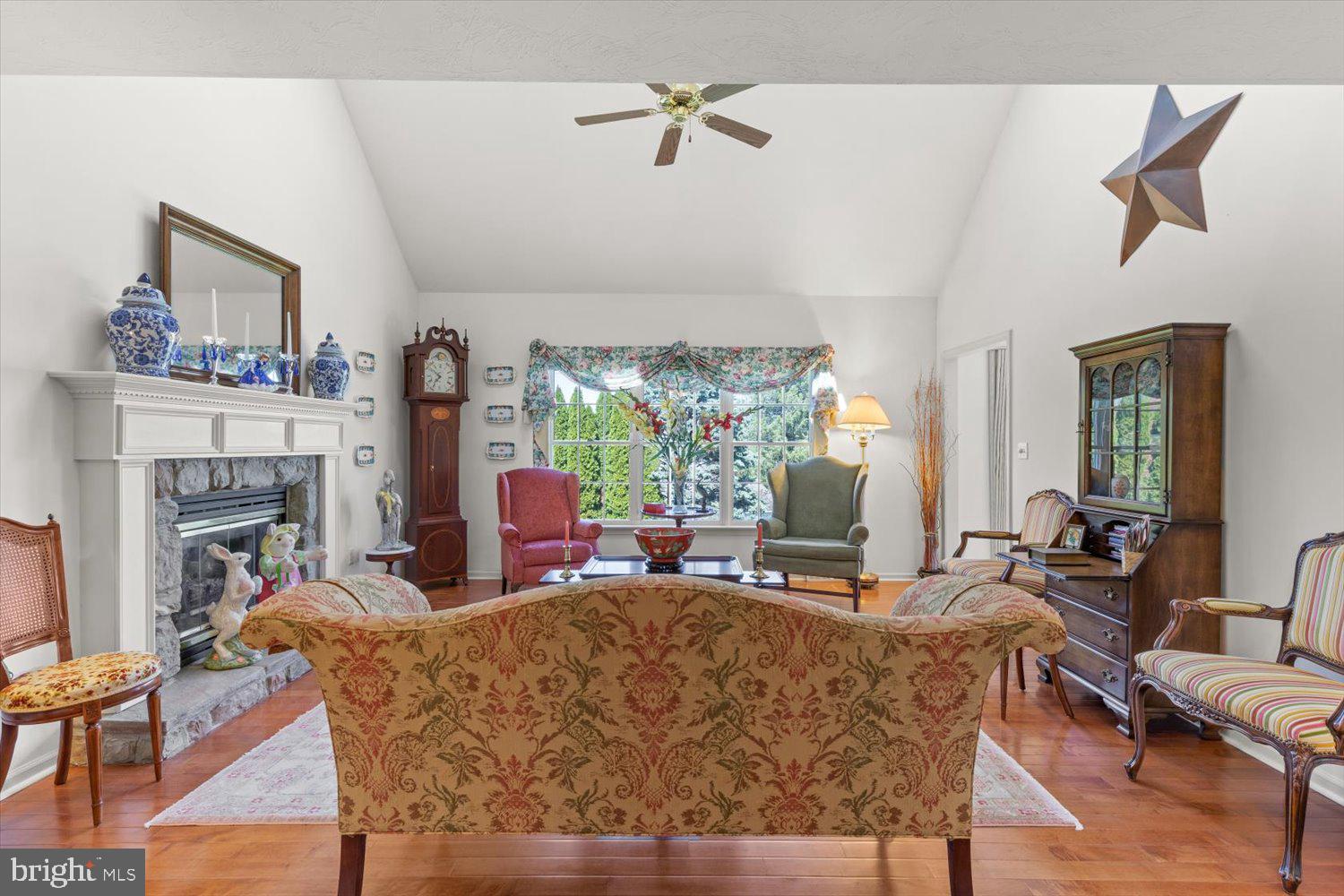 34 Ream Road Stevens, PA 17578 - Photo 16 of 53 a living room with fireplace furniture and a large window