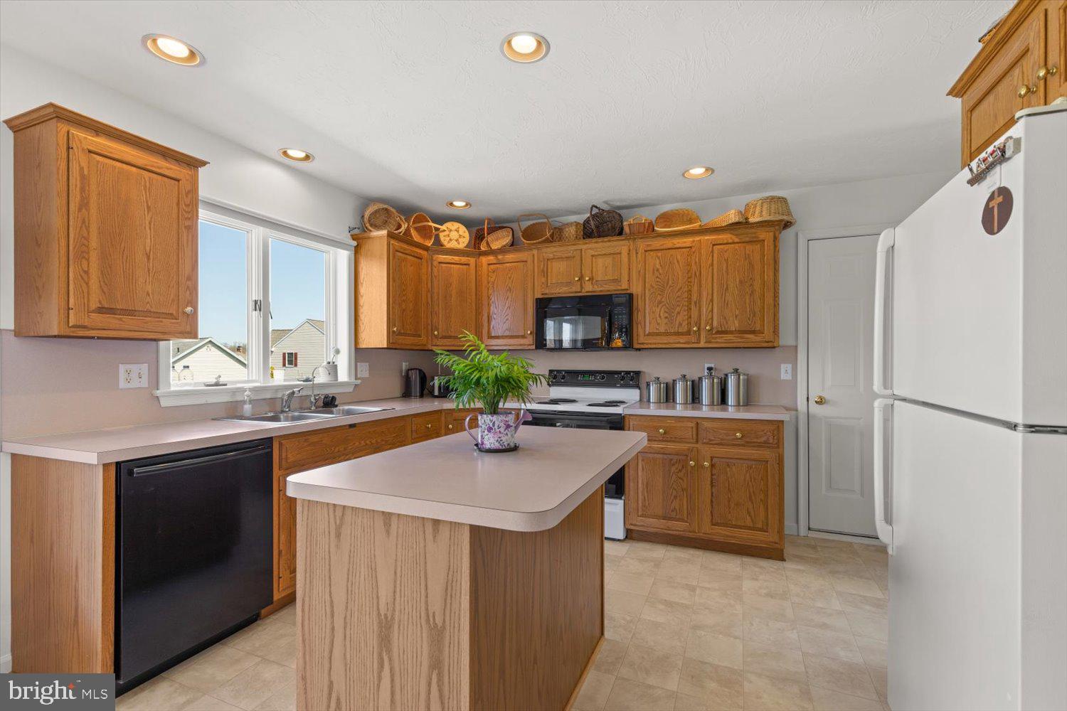 34 Ream Road Stevens, PA 17578 - Photo 10 of 53 a kitchen with stainless steel appliances granite countertop a sink stove and refrigerator