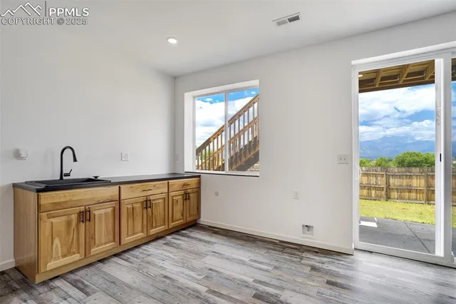 a view of a sink and a window in a room