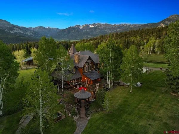 a swimming pool with some trees in the background