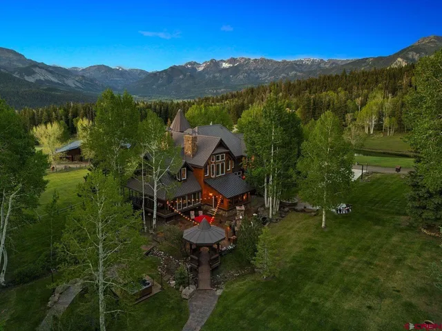 a swimming pool with some trees in the background