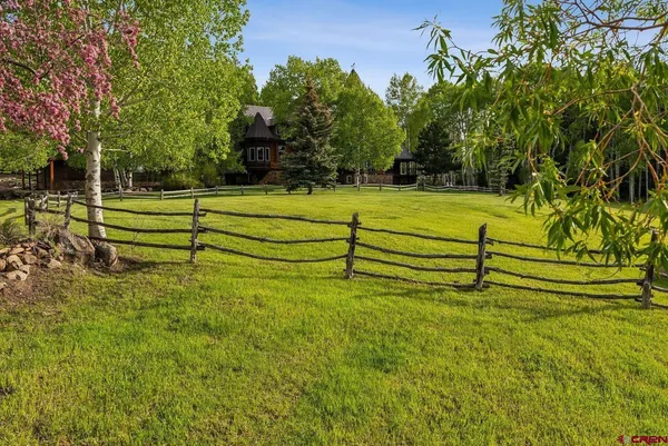 a view of swimming pool with a yard