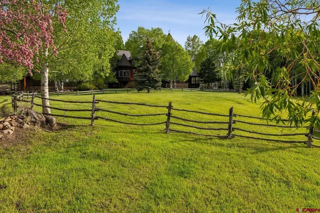 a view of swimming pool with a yard