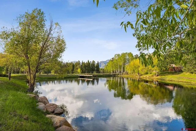 a view of a lake with a yard