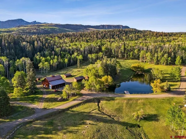 a view of an ocean with a mountain