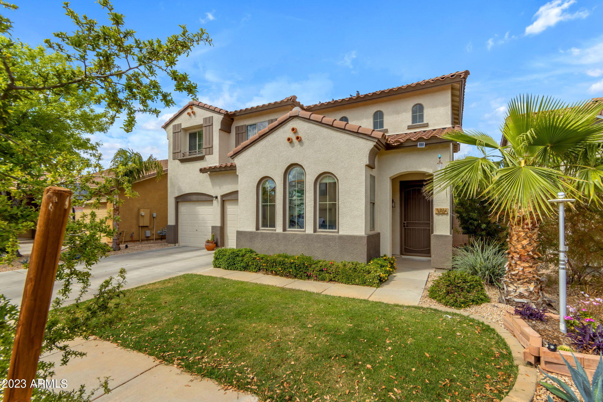 3816 East Phelps Street Gilbert, AZ 85295 - Photo 2 of 36 Lush Green Grass and Mature Landscaping