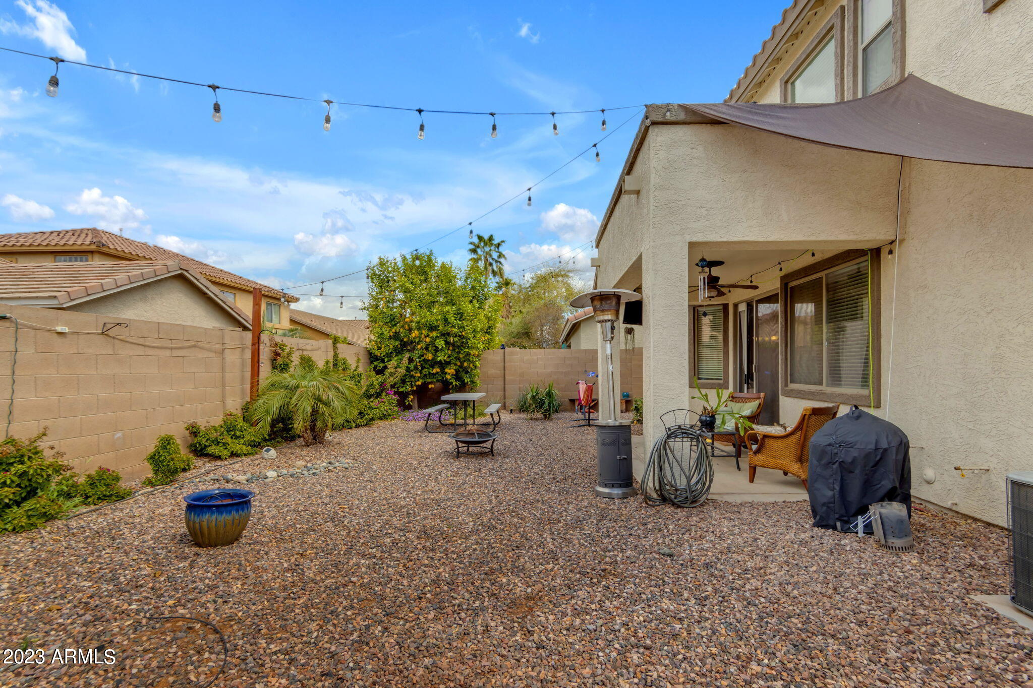 3816 East Phelps Street Gilbert, AZ 85295 - Photo 33 of 36 Spacious Yard with Bistro Lighting