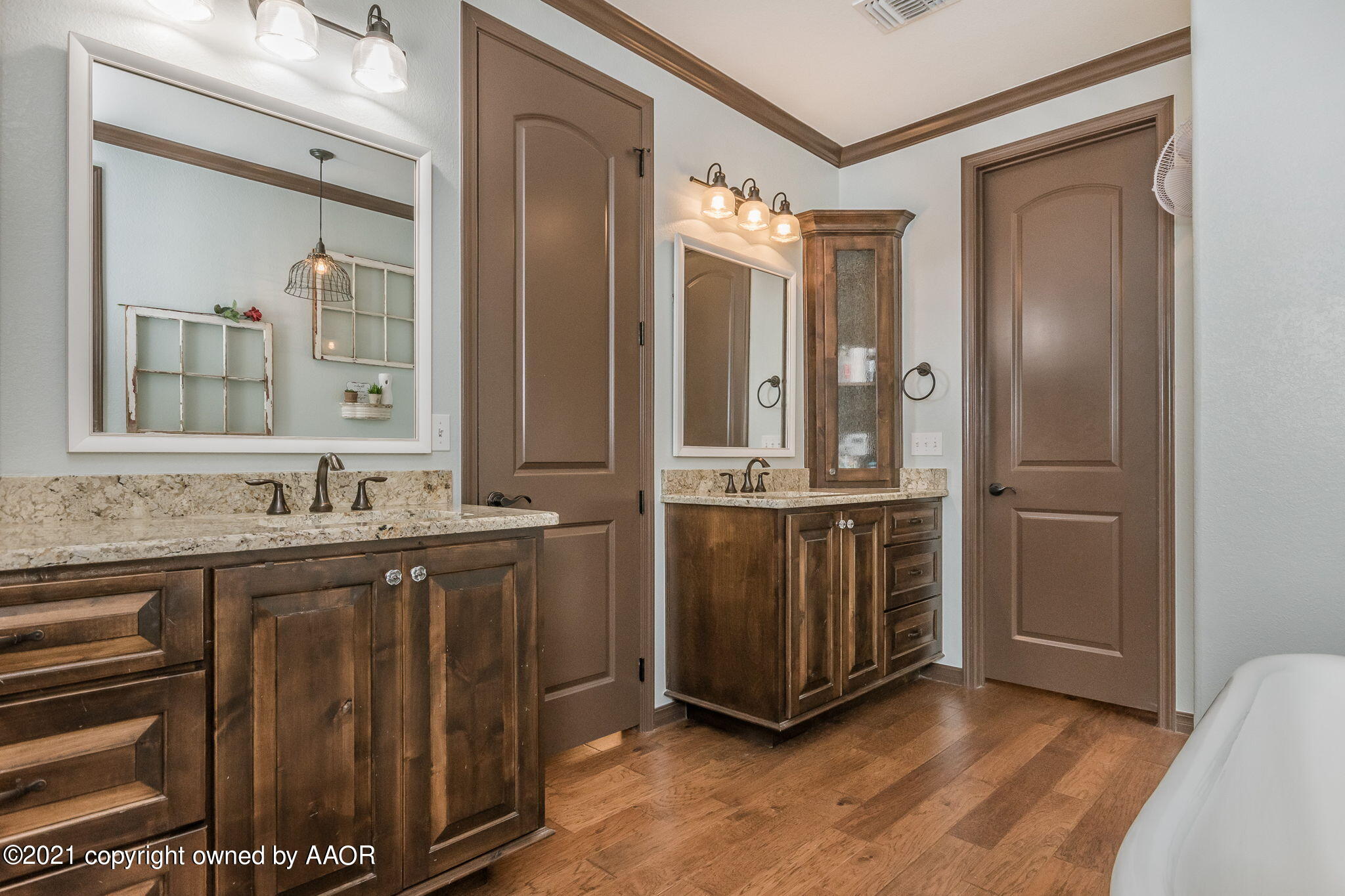 17500 Spring Lake Drive Canyon, TX 79015 - Photo 18 of 49 a bathroom with double vanity and a mirror