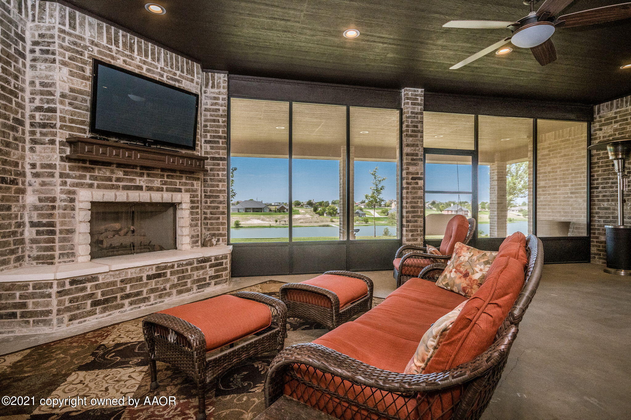 17500 Spring Lake Drive Canyon, TX 79015 - Photo 34 of 49 a living room with furniture a flat screen tv and a fireplace