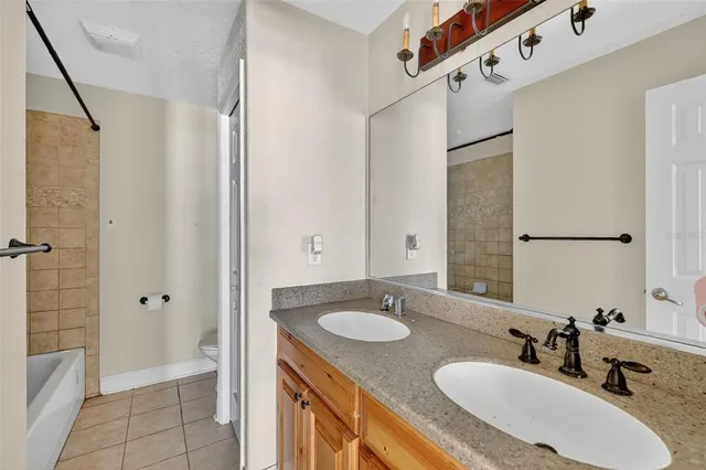 a bathroom with a sink double vanity and shower