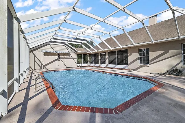 a view of a house with backyard and garden