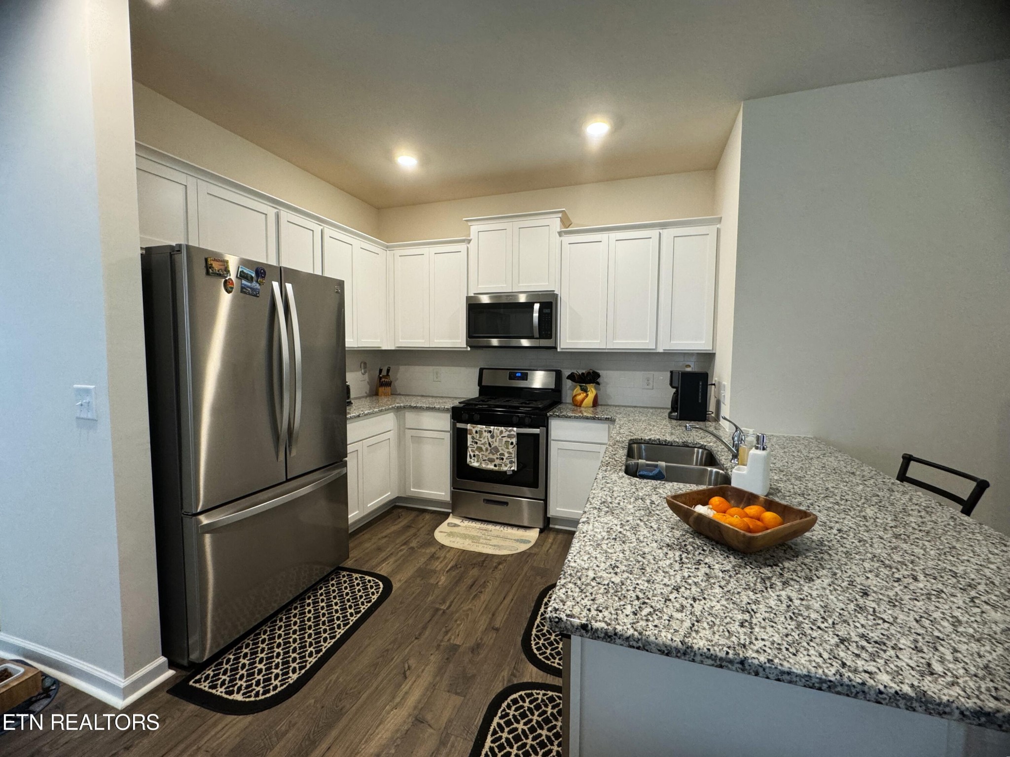 764 North Morelock Road Morristown, TN 37814 - Photo 3 of 18 a kitchen with granite countertop stainless steel appliances a refrigerator stove and sink