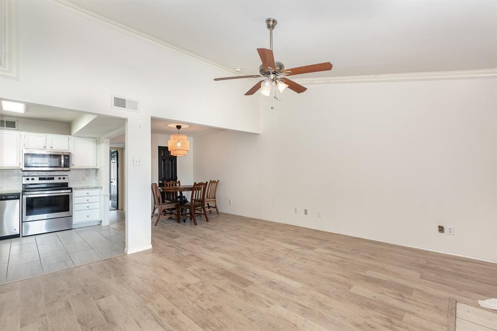 8750 Park Lane, Unit 151 Dallas, TX 75231 - Photo 11 of 33 a view of a kitchen and dining room