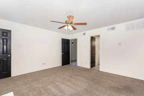 a view of a chandelier fan in a room