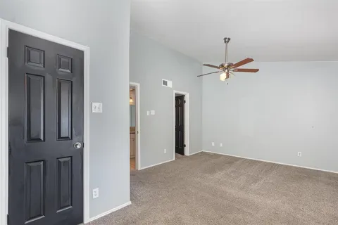a view of a livingroom with a ceiling fan