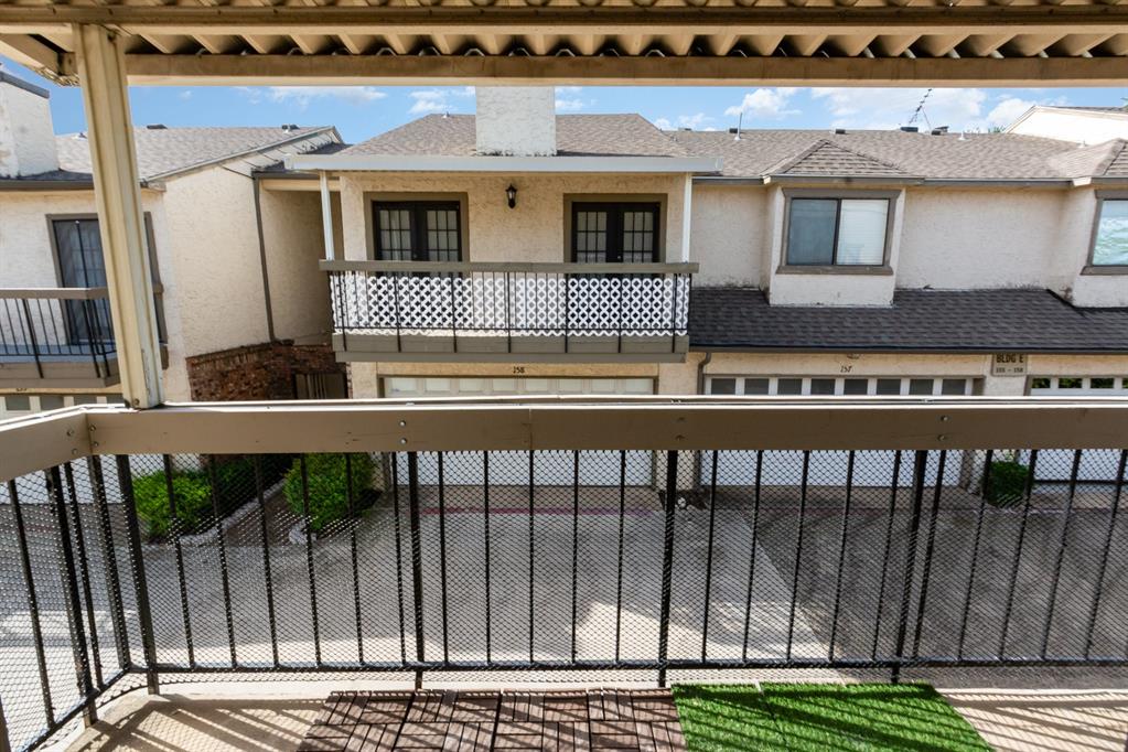 8750 Park Lane, Unit 151 Dallas, TX 75231 - Photo 28 of 33 a front view of a house with a balcony