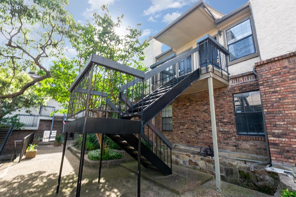 8750 Park Lane, Unit 151 Dallas, TX 75231 - Photo 4 of 33 a view of a house with backyard and sitting area