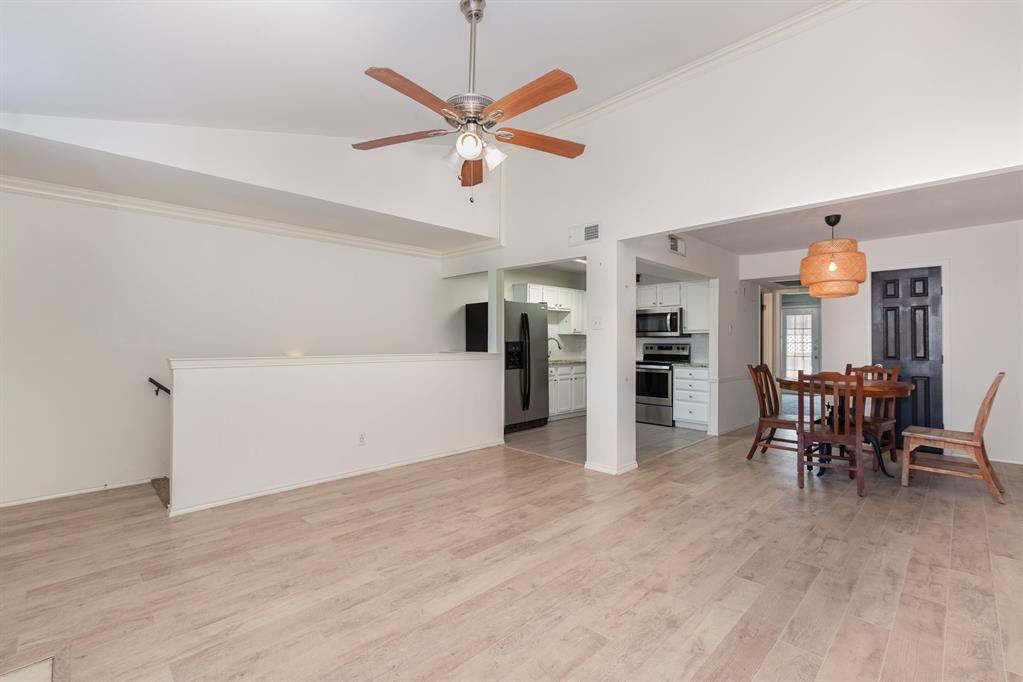 8750 Park Lane, Unit 151 Dallas, TX 75231 - Photo 7 of 33 a view of a room with furniture and a ceiling fan