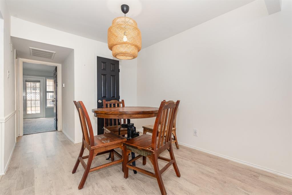 8750 Park Lane, Unit 151 Dallas, TX 75231 - Photo 9 of 33 a view of a dining room with furniture
