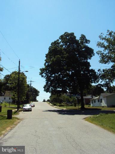 296 Upperlanding Road Essex, MD 21221 - Photo 1 of 13 a view of a street with houses