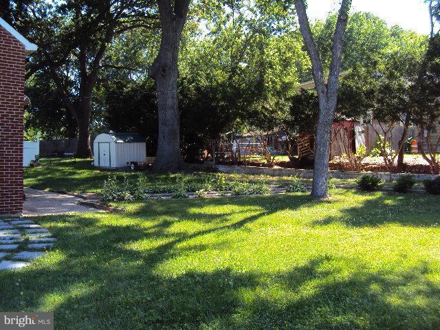 296 Upperlanding Road Essex, MD 21221 - Photo 2 of 13 a view of a garden with large trees