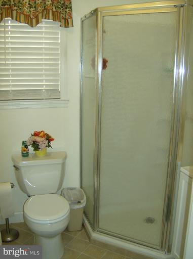 296 Upperlanding Road Essex, MD 21221 - Photo 5 of 13 a bathroom with a toilet and a shower