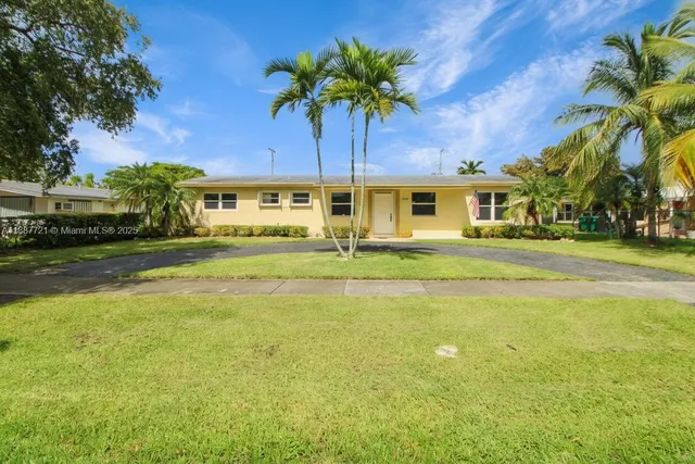 a front view of a building with swimming pool