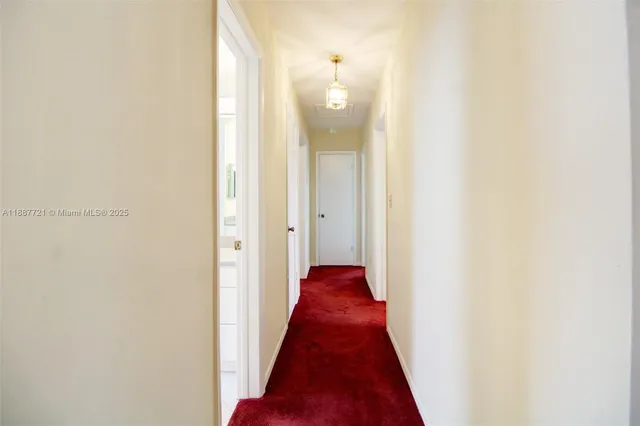 a view of a bathroom from a hallway