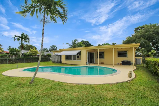 a view of a house with a swimming pool