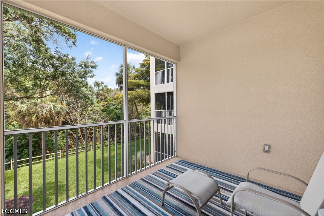 8251 Pathfinder Loop, Unit 621 Fort Myers, FL 33919 - Photo 27 of 30 a view of balcony with wooden floor