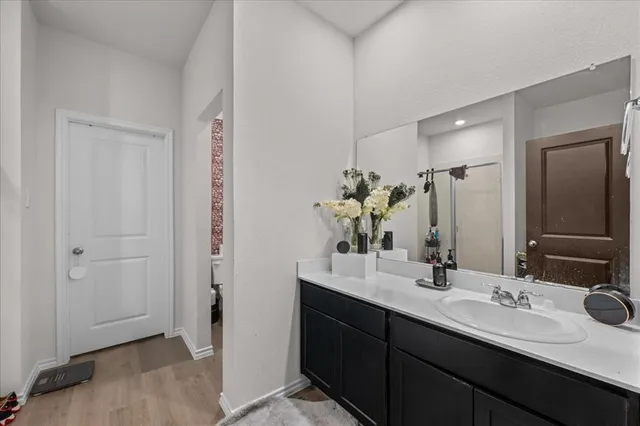 a bathroom with a double vanity sink and mirror