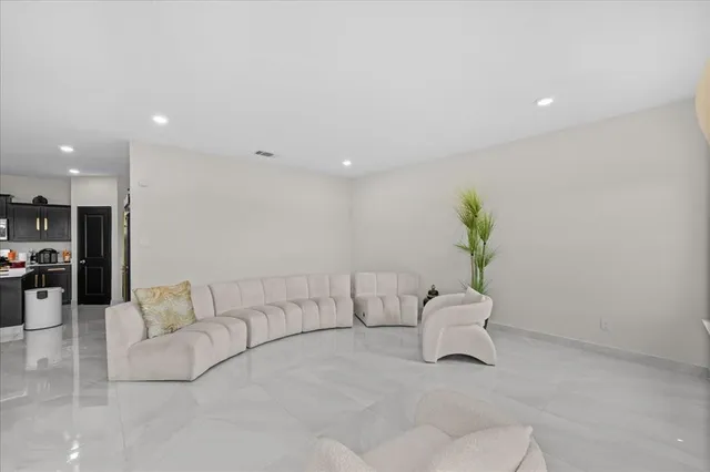 a living room with furniture and a couch