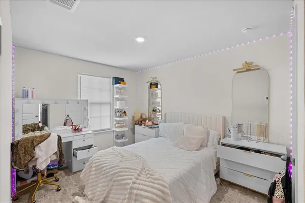 a bed room with a bed and a desk