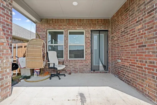 a view of a brick house with many windows