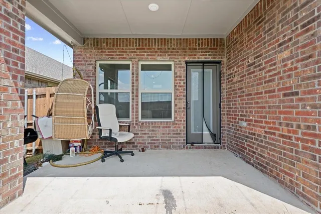 a view of a brick house with many windows
