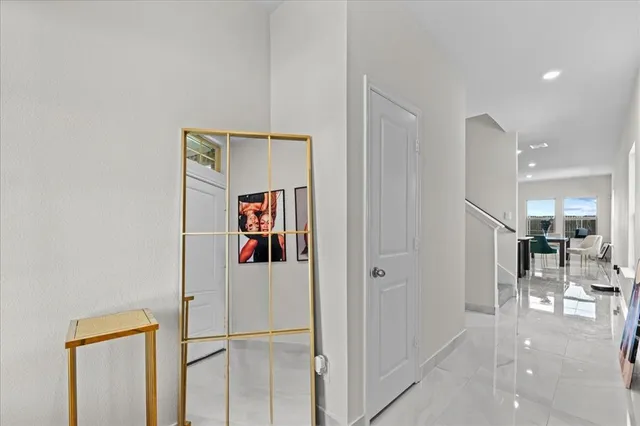 a view of a hallway with shelves