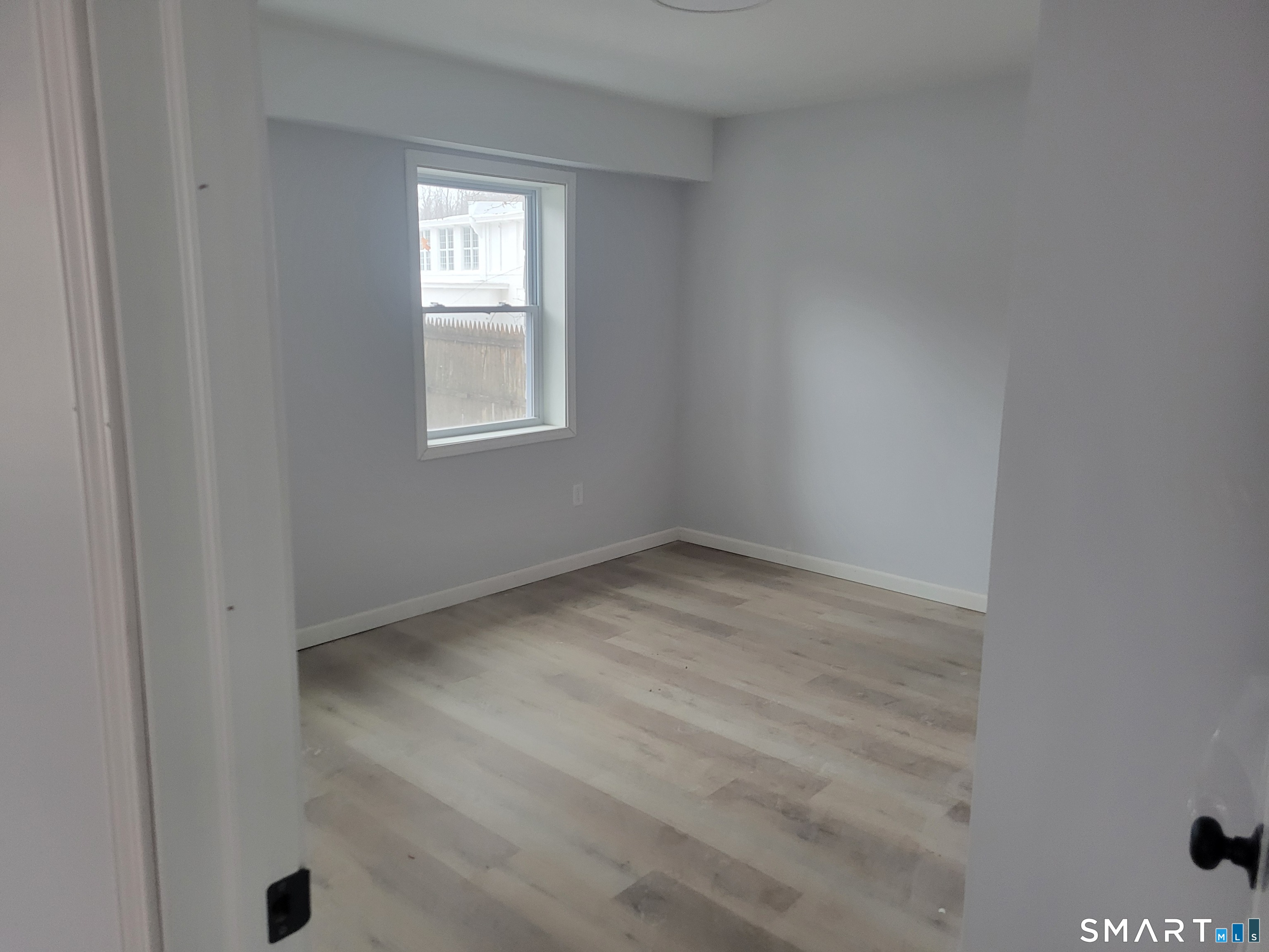 194 Hartford Road, Unit B Manchester, CT 06040 - Photo 6 of 6 a view of empty room with a window