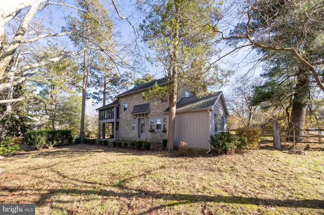 a view of a house with a snow in the yard