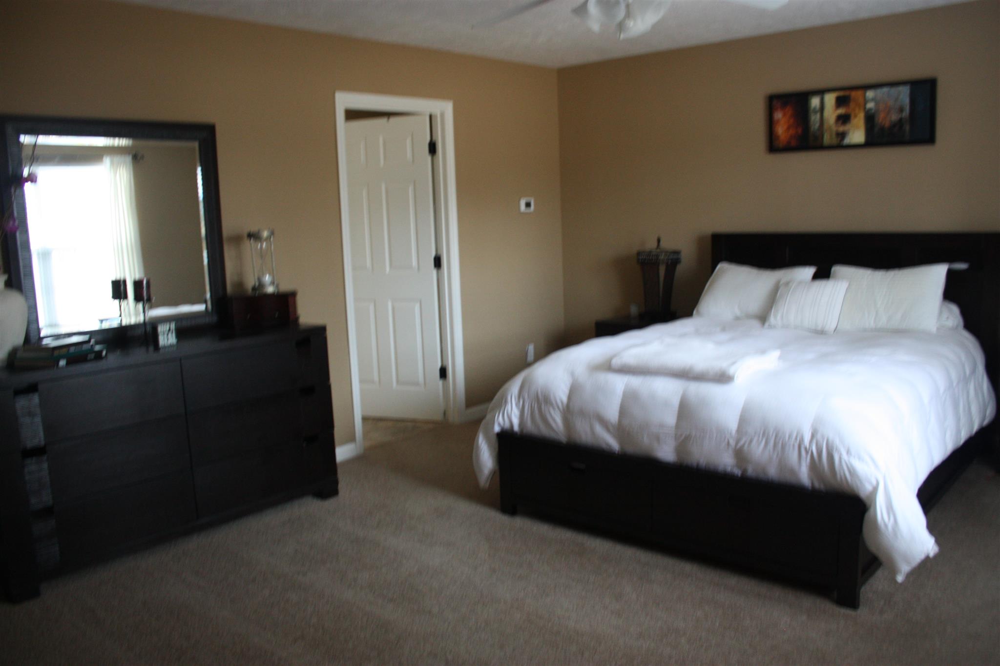 776 Cedar Grove Road Lebanon, TN 37087 - Photo 12 of 24 a bedroom with a bed and a dresser