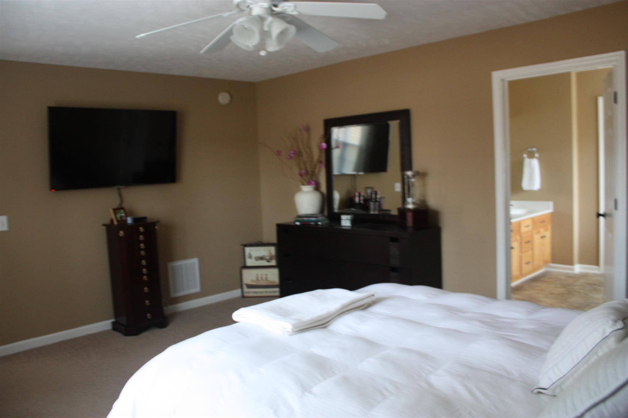 776 Cedar Grove Road Lebanon, TN 37087 - Photo 13 of 24 a bedroom with a bed and a flat tv screen on dresser