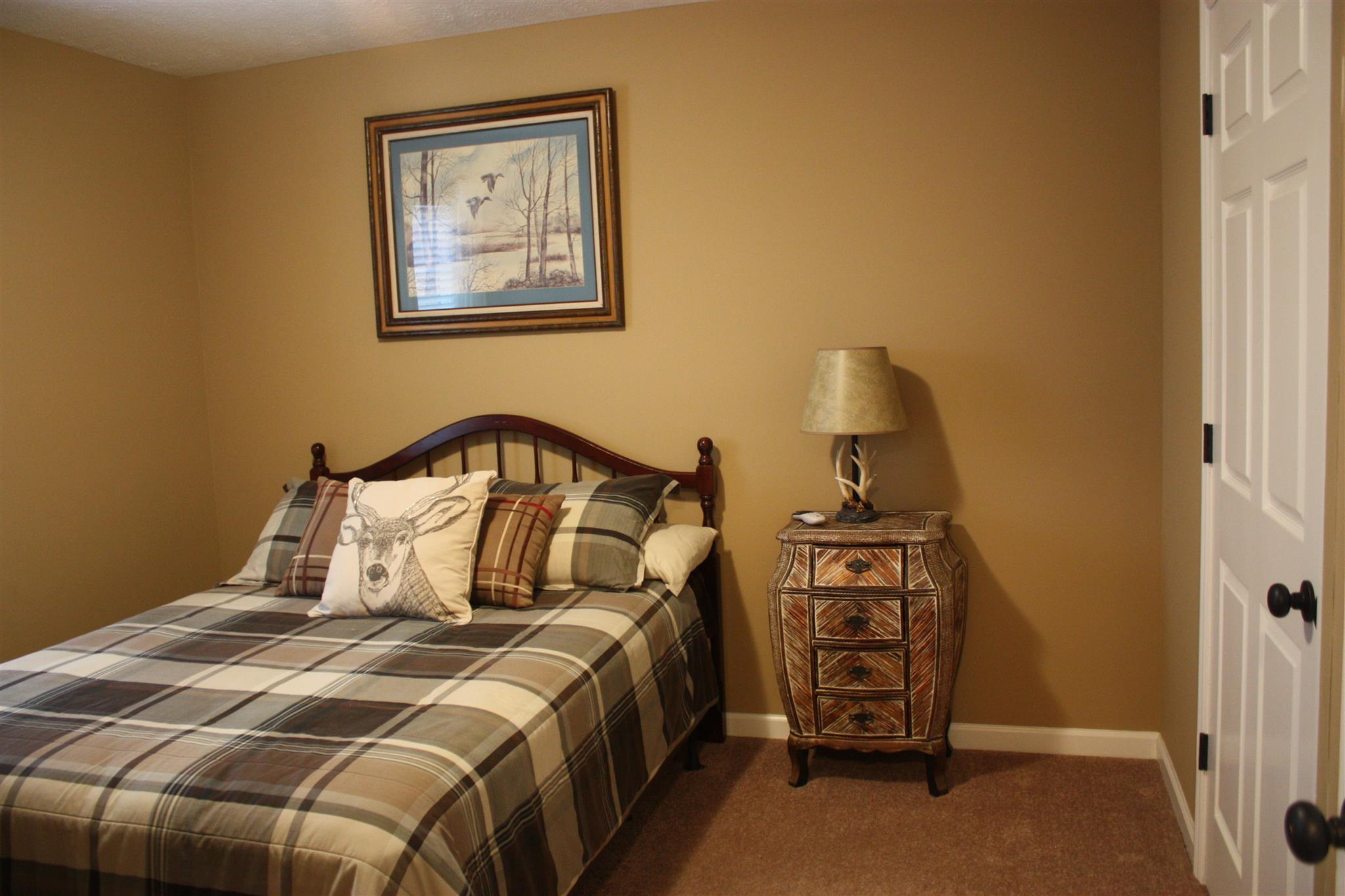 776 Cedar Grove Road Lebanon, TN 37087 - Photo 15 of 24 a bedroom with a bed and a lamp on the dresser