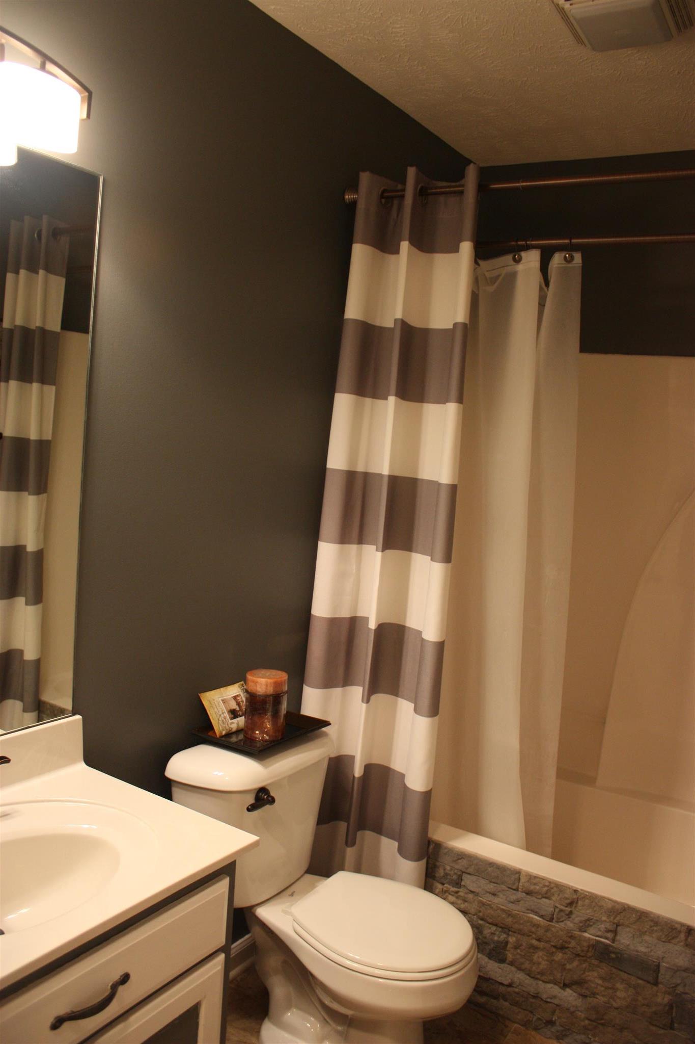 776 Cedar Grove Road Lebanon, TN 37087 - Photo 17 of 24 a white toilet sitting next to a bathroom sink