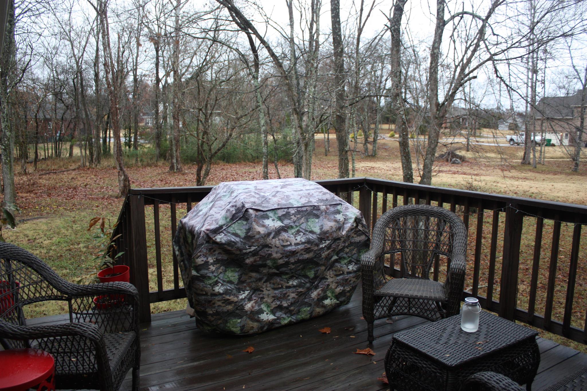 776 Cedar Grove Road Lebanon, TN 37087 - Photo 5 of 24 a view of a roof deck with table and chairs a barbeque with wooden floor and fence