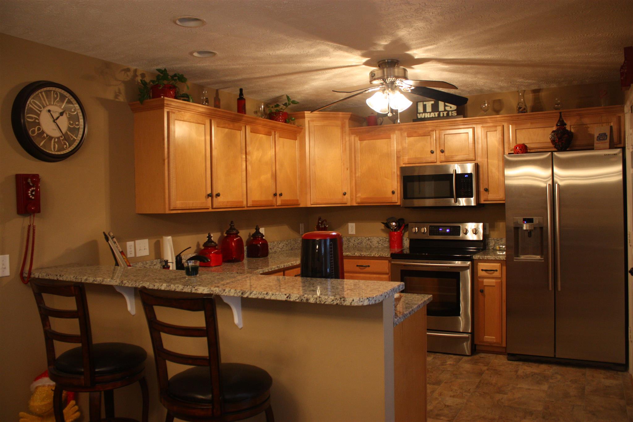776 Cedar Grove Road Lebanon, TN 37087 - Photo 9 of 24 a kitchen with stainless steel appliances granite countertop a sink and a refrigerator
