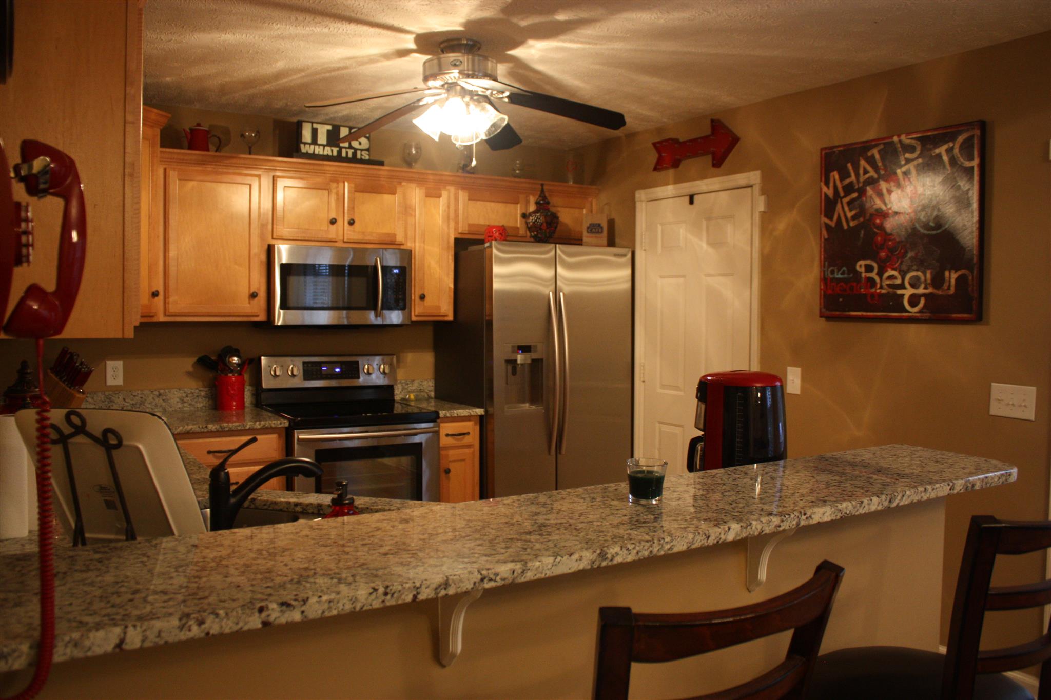 776 Cedar Grove Road Lebanon, TN 37087 - Photo 10 of 24 a kitchen with stainless steel appliances granite countertop a sink refrigerator and microwave