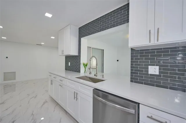 a bathroom with a double vanity sink and mirror