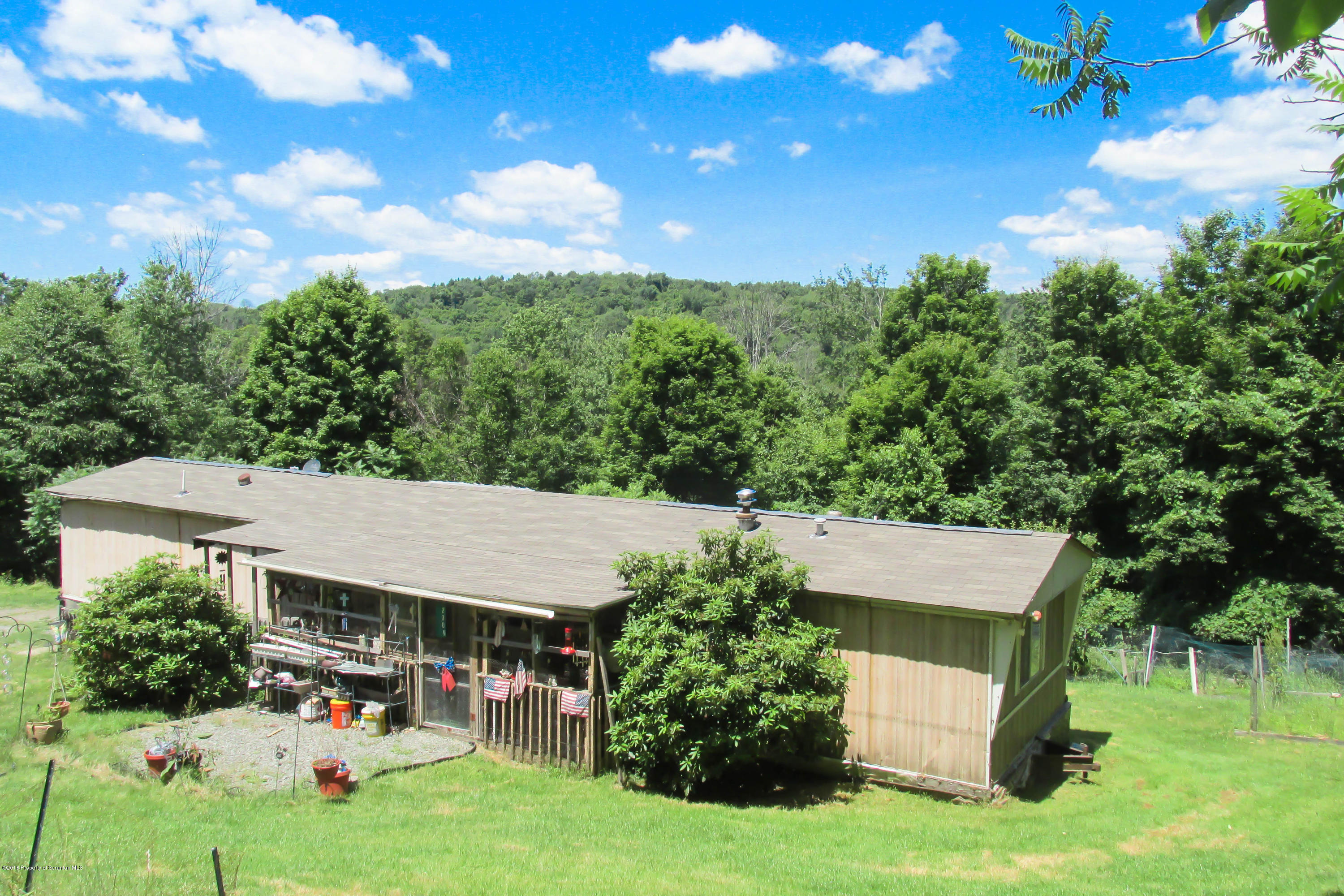 2309 White Pond Road Meshoppen, PA 18630 - Photo 1 of 21 an aerial view of a house with a yard