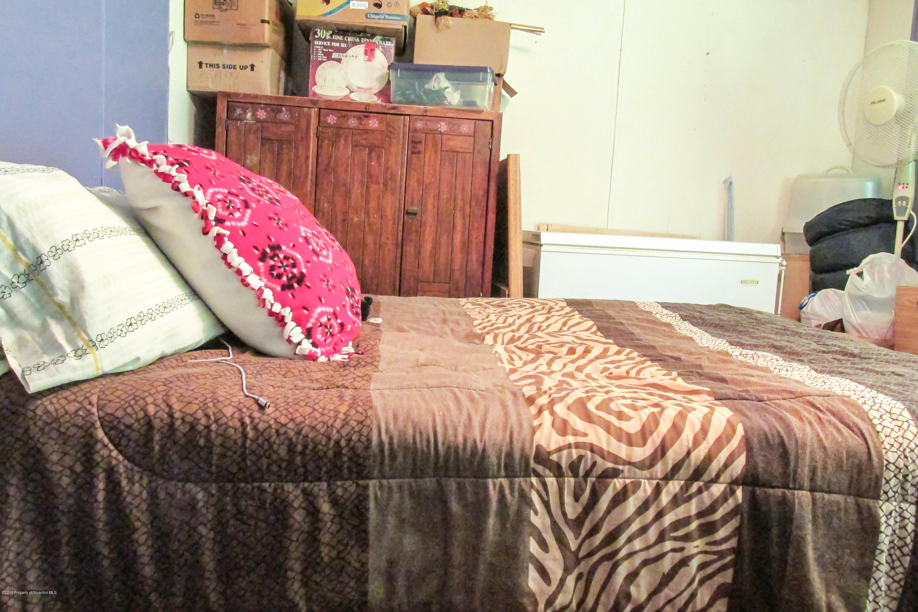 2309 White Pond Road Meshoppen, PA 18630 - Photo 12 of 21 a bedroom with a bed and a painting on the wall