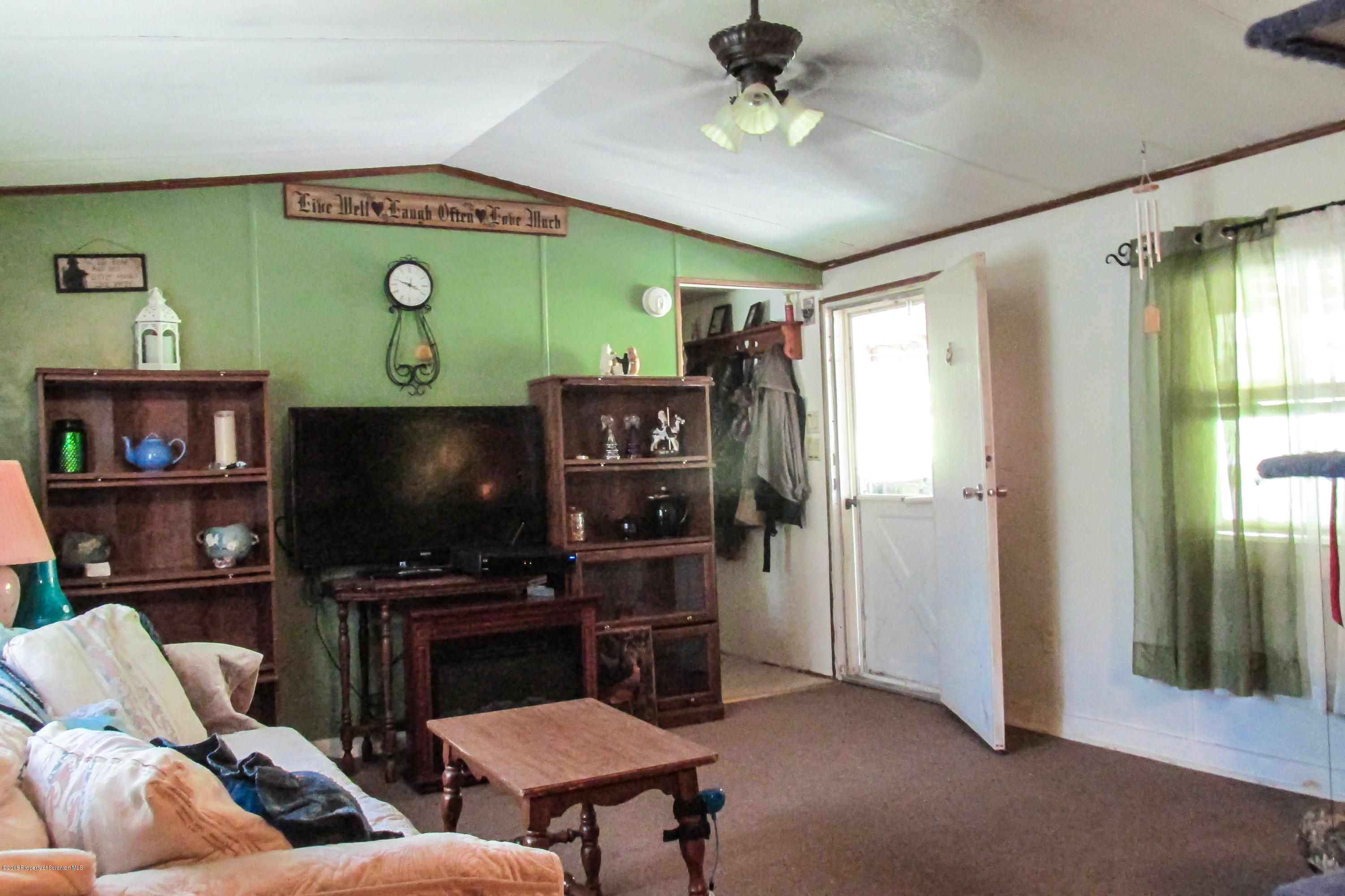 2309 White Pond Road Meshoppen, PA 18630 - Photo 2 of 21 a living room with furniture and a flat screen tv