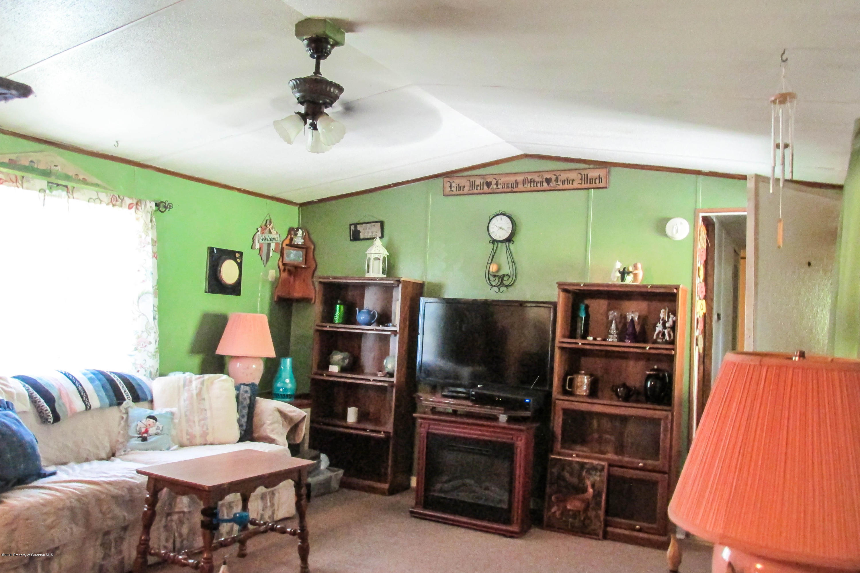 2309 White Pond Road Meshoppen, PA 18630 - Photo 3 of 21 a living room with furniture and a flat screen tv